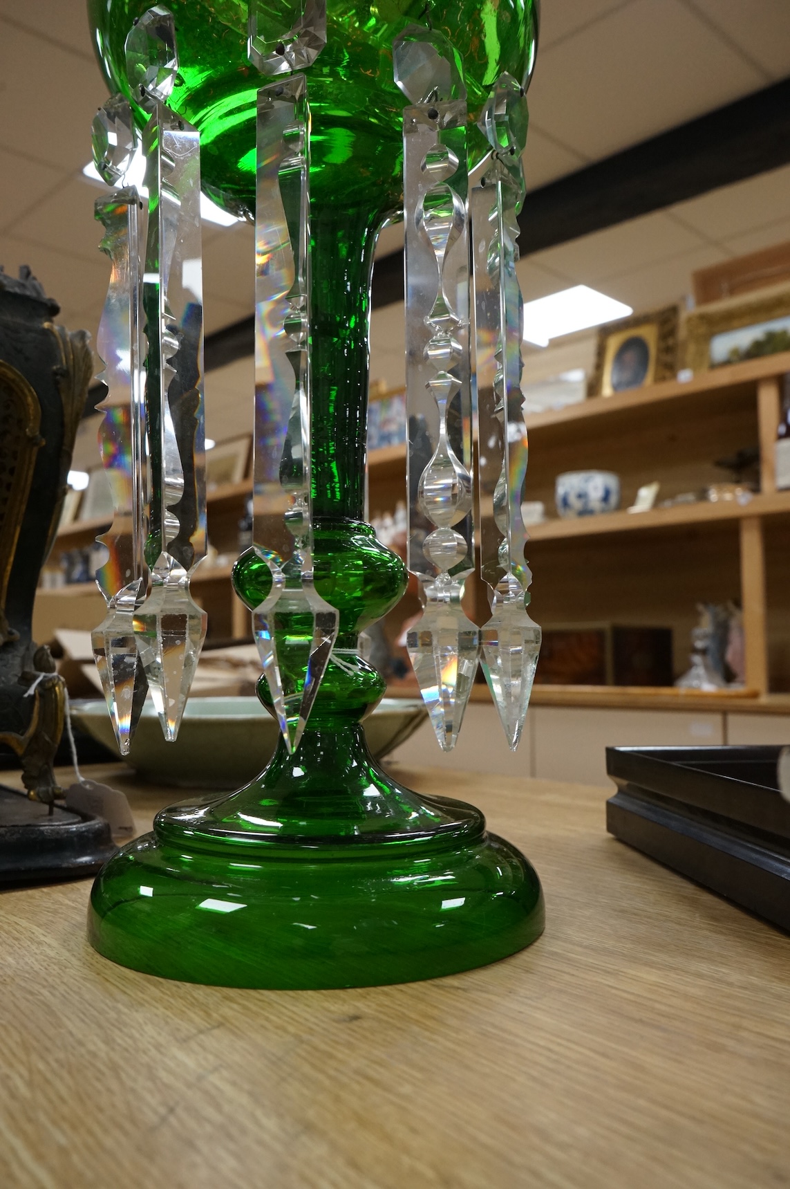 A large Victorian green glass lustre with drops, 45cm high